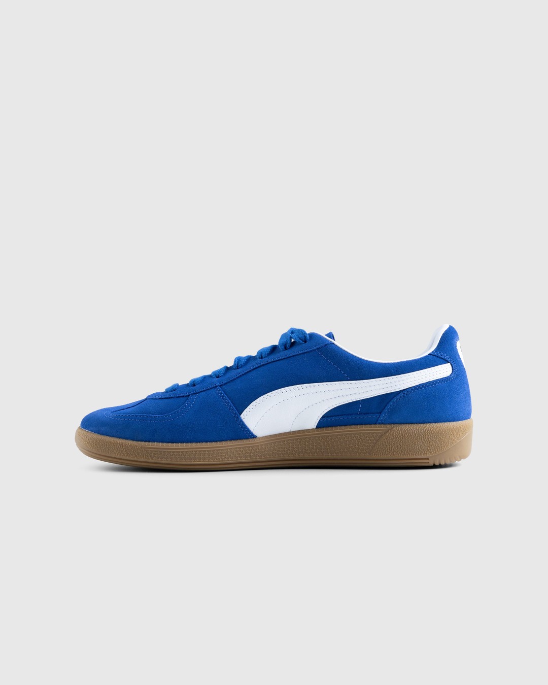 White and blue puma sneakers top